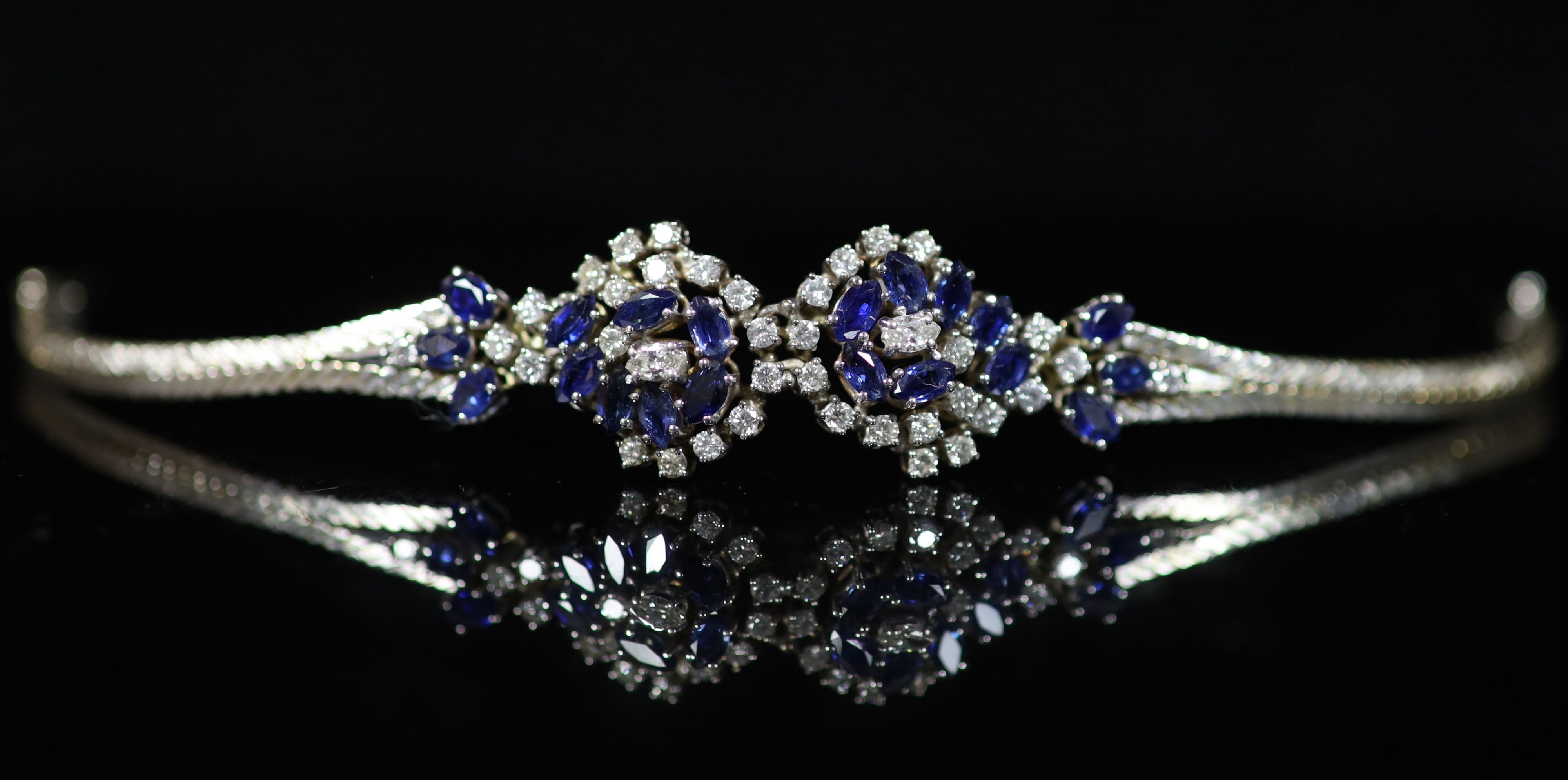 A 18ct white gold sapphire and diamond set double cluster bracelet